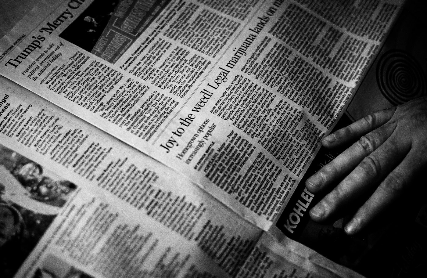 A classic black and white photo of a reader in Kochi enjoying a morning Malayalam newspaper